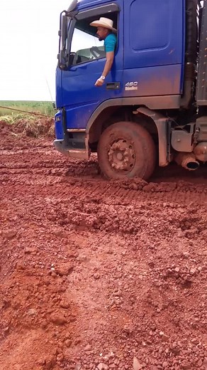 Stuck Blue Truck in Muddy Construction Area