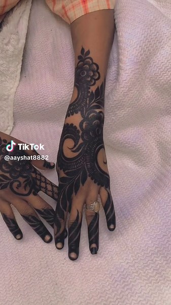 Intricate Black Henna Designs on Hands