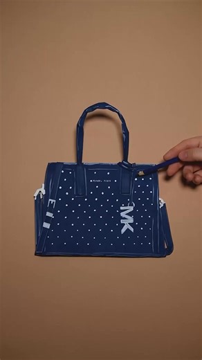 Let us paint you a picture—Maria Rec recreates our studded Laila satchel through layers of paper art. | Michael Kors