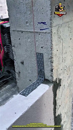 Worker Hammering a Steel Bracket into a Concrete Column for Wall Reinforcement #constructionwork