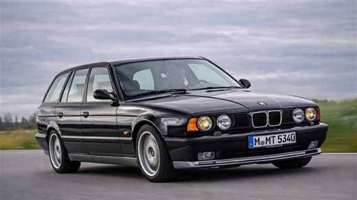 BMW M5 Touring driving at high speed on Autobahn