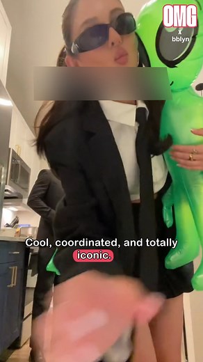 Black suits, inflatable aliens, and secret agents. This is how you coordinate a costume. 🕶️ | OMG