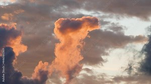 Time lapse of rolling puffy sunset clouds are moving, orange clouds time lapse. Clouds running across the cloudy sky. 4k Timelapse of white clouds with sunset sky background Stock Video