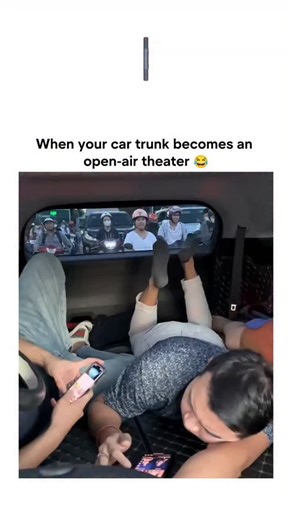 Explore World on Instagram: "The video depicts a couple in an intimate position in the open trunk of a parked van on a busy street, surrounded by motorbikes and pedestrians, turning a private moment into a public spectacle that sparks widespread laughter. Posted by @manggalakurnia , whose account focuses on funny and romantic clips, the content exploded to 5.7 million views and 7,800 likes in under a day, reflecting viral appeal of relatable awkward encounters. Indonesian replies like "malu bang