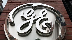 General Electric reports earnings, climbs after beat