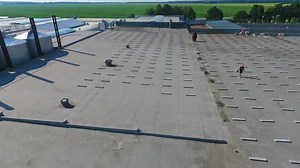 Building the solar farm on flat roof