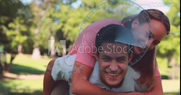 Man carrying woman on his back in park, she climbing starting tech HUD overlaying for fun