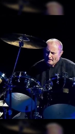 Watch as Phil Collins performs a drum solo on his 2004