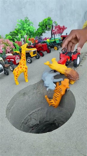 red tractor pushing cow horse tiger and elephant in pit #jcbtoy​ #jcb​ #jcbjcb​ #jcbvideo​ #viral