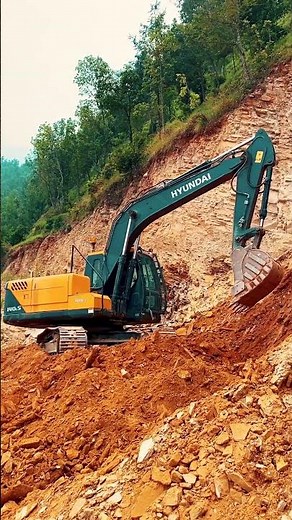 Hyundai Excavator in Action, Building Mountain Road