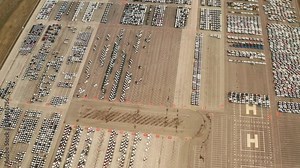 large parking lot of new cars from car factory in slovakia , kia