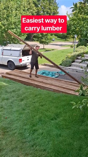 Easiest way to carry lumber is on your shoulder once its balanced it feels lighter #deck #deckbuild