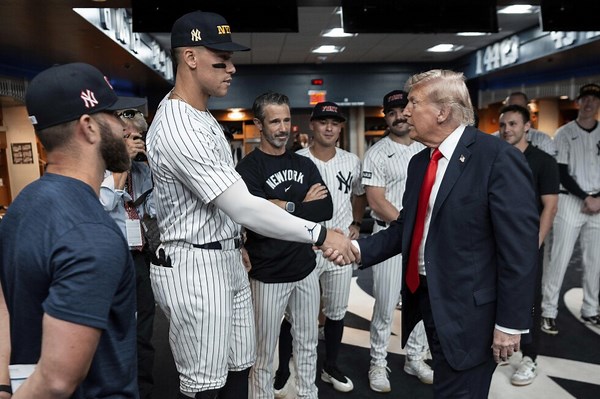 Trump draws cheers and boos while marking 9/11 by attending a New York Yankees game