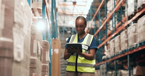 clip-3964094977-logistics-tablet-woman-warehouse-barcode-reader-stock