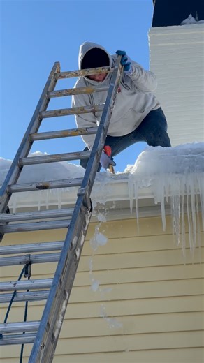 The ice dams that build up at the edge of your roof slowly melt in the sun during the day. The water creates large pools that eventually makes its way underneath the shingles. You can see here all the water that rushed out when we broke through the ice dam. Before we did this that water was dripping inside the house. | Burr Brown Design