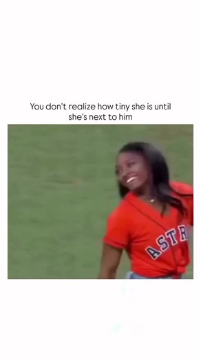 TrendTok Hub on Instagram: "The post shares a video clip of Olympic gymnast Simone Biles, standing at 4 ft 8 in (142 cm), beside her husband Jonathan Owens, a 5 ft 11 in (180 cm) NFL safety, during a stadium appearance, underscoring their striking 15-inch height disparity. Rainmaker1973, known for curating awe-inspiring visuals, uses the footage to playfully highlight Biles' petite build, a trait advantageous in gymnastics for leverage and power-to-weight ratio, as supported by biomechanical stu