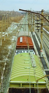 Cargo train. 60 fps vertical 4k footage. of a railway tracks, wagons and wheels of a freight train. Delivery of cargo and goods all over the world. Long-distance freight transportation.
