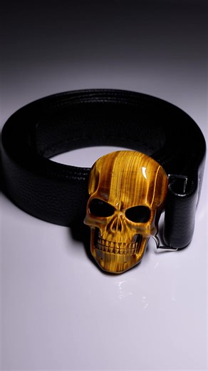 Eyes of the Tiger, soul of the stone. Elevate your everyday with the grounding energy and golden shimmer of our Tiger’s Eye Skull Buckle. A masterpiece of nature, carved for the bold. #skulljewelry #gemstone #skullis #handmadejewelry #skullart