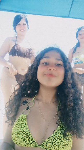 Beach Day Fun with Friends in Colorful Bikinis