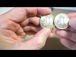 A new 500 yen coin received as change (new and old 500 yen coins issued in 2021)