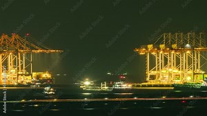 Cranes loading containers to cargo freight ship in commercial shipping port time lapse video.