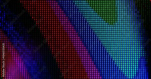 macro view of 4K LED matrix red, blue, and green sub-pixels monitor. Colored pixels texture creates an abstract pattern. RGB cells in the LED panel