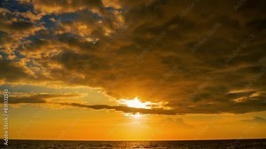 Sunset timelapse 4k Colorful sunset at the sea. Romantic Sunet go down, blue and orange clouds flow in sky. Majestic summer landscape. Beautiful sky fluffy clouds evening day