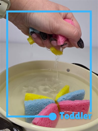 This simple sponge activity builds the grip stability they need for pencil control later ✏️ All you need is: 🧽 Sponges 🪢 Elastic band 💧 Water 🪣 A tub Full video on building hand skills is on my YouTube. #finemotorskills #toddleractivities #preschoolactivities #playbasedlearning #handstrength #mumlife #learningthroughplay