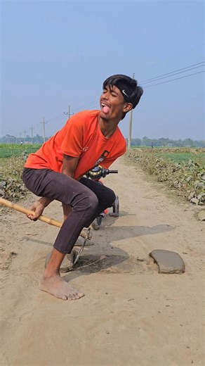 A Little boy is having fun with his bicycle?7796