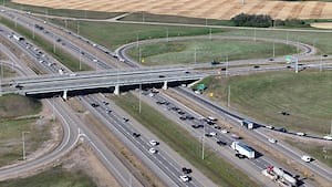 Excavator crashes into Whitemud overpass, slowing traffic on Anthony Henday Drive