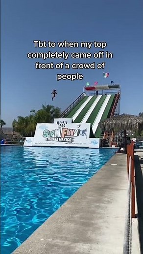 Girl s swim suit top comes off in midair after going down a water slide