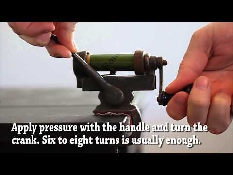 Roll crimping shotshell with antique tool