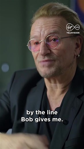 "I'm Irish. Bob Geldof's Irish. We have a folk memory of famine." Lead singer of 70’s Irish breakthrough rock band, U2, Bono reflects on the lines he was assigned to sing in Band Aid's 'Do They Know It's Christmas'. "I will attempt to be worthy of that cruel prayer." #LiveAidAt40 | Starts Saturday at 10pm on Virgin Media Play & Virgin Media One 📺 | Virgin Media Television