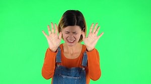 clip-1045344550-annoyed-woman-stress-green-screen