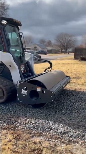 VIBRATORY COMPACTION ROLLER ON GRAVEL DRIVEWAY. #bobcat