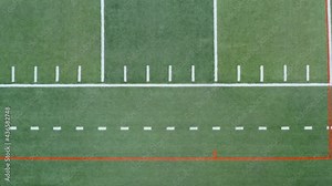 Top down aerial of yard markings on American football, soccer field. Sports and athletics in USA.