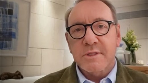 Kevin Spacey clarifies in an Instagram video that he's not homeless in a literal sense, but rather, choosing to live wherever he finds work. | Entertainment Tonight