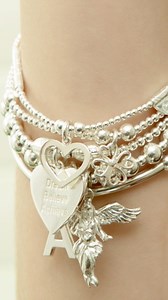 3.2K views · 37 reactions | Annie talking us through the Sama My Guardian Angel bracelet stack 懶 As one of our most iconic pieces, it’s no surprise how much we all love this stack 朗 a stunning collection of 5 hand-threaded bracelets featuring two customisable charms! This stack also features our very special My Guardian Angel charm, a charm of very special meaning to Annie, designed to offer protection to the wearer 懶 | Annie Haak Designs Ltd | Facebook