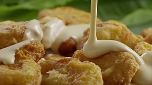 Scientists harvested cells from chicken feathers to create delicious nuggets. | Futurism Grocery