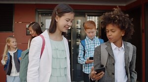 clip-1038372194-medium-shot-five-classmates-rucksacks-going-out