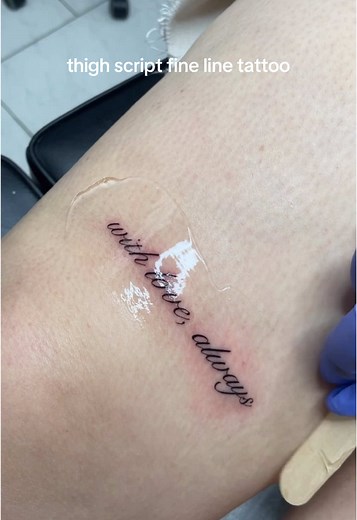 Elegant Script Tattoo Designs on Thighs