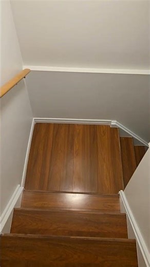 stairs to the basement trim white and walls painted .transformed