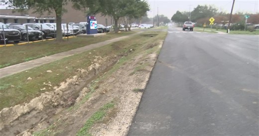 Lafayette Parish school bus slides into ditch near Comeaux High