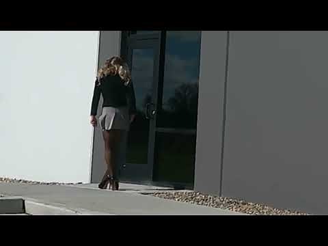 Closer view of Blonde mini skirt blowing in the wind with nylons, thong and high heels/stilettos