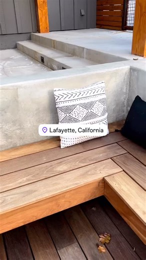 OutdoorLivingGardens | Landscaping & Design on Instagram: "So many different elements came together to create this front yard. Concrete work, an Ipe deck with custom benches, a custom fire pit, planting, landscape lighting, and an epic outdoor kitchen built from concrete — complete with a pizza oven, Green Egg, and gas grill. And of course… the crew and I put in the blood, sweat, and tears to bring it all to life."