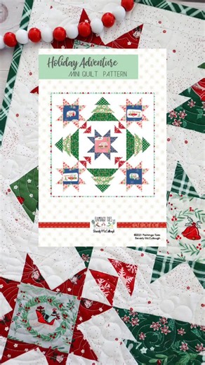 Bev { Flamingo Toes } on Instagram: "My Holiday Adventure Mini Quilt just got a makeover! I loved making this pattern again in my latest holiday fabrics😍 I love the classic colors with this pattern.⁠ ⁠ Pattern: Holiday Adventure Mini Quilt (available as a PDF or paper pattern)⁠ Fabric: Mistletoe & Holly⁠ ⁠ Find both in my shop!"
