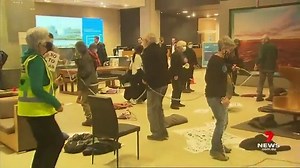 DEVELOPING: Extinction Rebellion activists are staging a bizarre protest at Santos’ office in the CBD. www.7NEWS.com.au #7NEWS | 7NEWS Adelaide