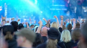 A huge crowd at a rock concert. Fans waving their hands. Stock Video