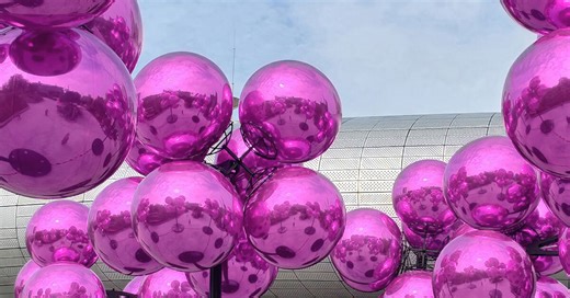vincent leroy's kinetic cloud sculpture of glossy pink spheres hovers at seoul's design plaza