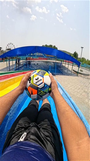 Football Passing All The Way To The Splashdown Pool! ⚽️💦 #GridironGlide #AquaticToss #SyncSliding